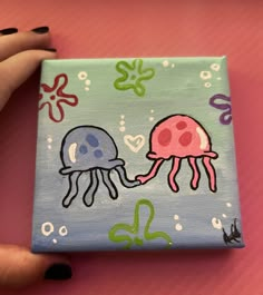 a painting of two jellyfishs on a blue and pink square with hearts in the background