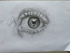 a drawing of an eye with long eyelashes