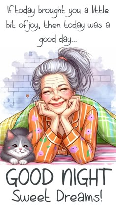 an older woman laying on top of a bed next to a cat and smiling at the camera