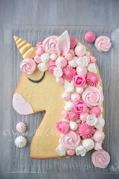 a decorated cookie with pink and white frosting