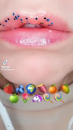 a close up of a person's lips with candy and candies on them