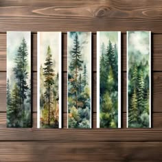 four watercolor paintings on wood with pine trees