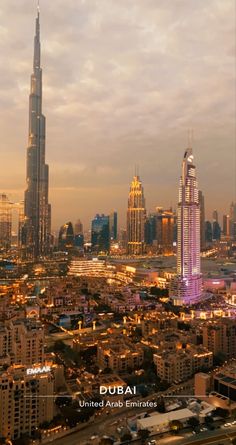 an aerial view of the city at dusk with tall buildings and skyscrapers in the background