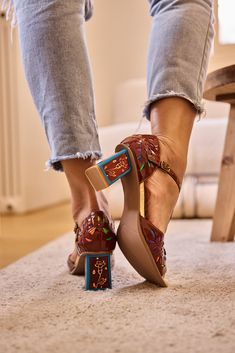 Take a step on the wild side with the Soffia Roselynn Pump! Featuring a bold rainbow leather and intricate floral perforations, these pumps are perfect for those who dare to stand out. The T-Strap design adds a touch of adventure to any outfit. Elevate your style and embrace the thrill with the Roselynn Pump from our exclusive romance you life collection! 2.56" heel Hook & loop adjustable buckle closure Genuine leather upper Leather footbed Leather lining Leather midsole Rubber sole Best Shoe Brands, High End Sneakers, Reindeer Headband, Sneakers Womens, Grey Crewneck, Strap Pumps, Strap Design, Fall 2024, T Strap