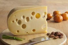 cheese and nuts on a cutting board - stock photo - images