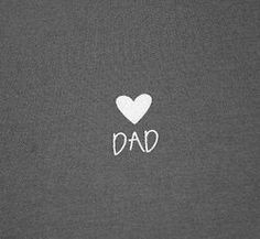 the word dad written in white on a grey background with a heart shaped sticker