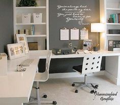 a white desk sitting in front of a book shelf