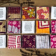 several different types of cloths laid out on top of each other next to dried flowers