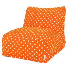 an orange and white polka dot print chair