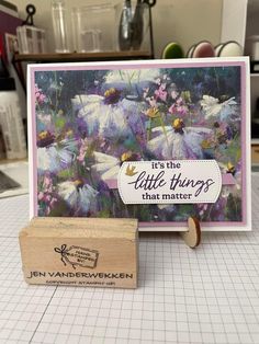 a rubber stamp that says it's the little things that matter with daisies