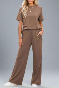 Experience unparalleled sophistication with this exquisite coordinated 2-Piece Pant set. It includes a classic t-shirt and luxurious wide leg pants, both crafted from ultra-soft fabric for maximum comfort. Enhance your outfit with elegant sandals, stylish sneakers, or chic flats for a truly elevated look. Strive for both style and comfort, embodying luxury and refinement.Size Chart (INCH) Sizes Bust Waist Hem_Width Shoulder Sleeve_Length Length Hip Bottoms Inseam Outseam Relax Relax Relax Relax Casual Solid Color Wide-leg Pants Set, Casual Solid Wide-leg Pant Sets, Casual Wide-leg Pants Set, Casual Brown Workwear Sets, Wide Leg Loungewear Sets In Solid Color, Relaxed Fit Solid Color Workwear Sets, Casual Workwear Pants With Matching Set, Chic Flats, Elegant Sandals