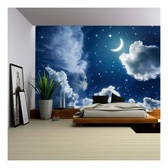 a bedroom scene with the moon and stars in the sky above the clouds wall mural