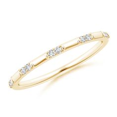 a yellow gold wedding band with diamonds