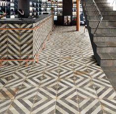 the inside of a store with stairs and shelves