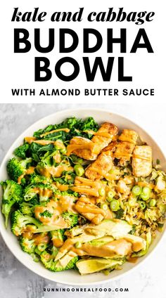 a white bowl filled with broccoli, chicken and cauliflower on top of a table