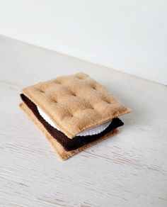 a small piece of food sitting on top of a white table