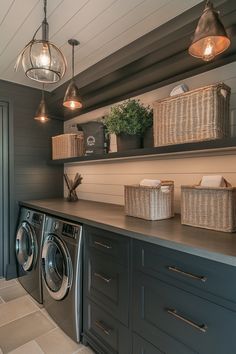 a washer and dryer in a laundry room with hanging lights above the washer