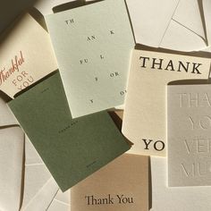 several thank you cards are arranged on top of each other with the words thank you