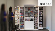 a woman standing in front of a book case filled with lots of books and magazines