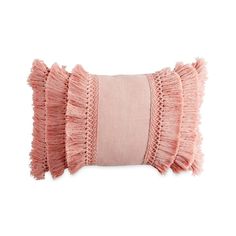 a pink pillow with ruffled edges on a white background