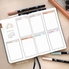 an open planner with pencils and markers