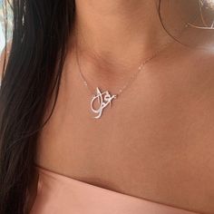 Our jewelry is always long lasting, beautiful, and of the highest quality. Our Persian (Farsi) and Arabic name necklaces are classic, unique pieces that are worth the investment. Personalize your necklace with this beautiful writing. We are happy to translate for you and we can't wait for you to fall in love with your very own piece. Compared to our print calligraphy Persian nameplates, this version has a script calligraphy style font. The letters and names have a more abstract, artistic style. Formal Nameplate Initials Necklace, Formal Initials Nameplate Necklace, Elegant Engraved Pendant Necklaces, Elegant Engraved Pendant Necklace, White Gold Name Pendant Necklaces, Elegant Pendant Name Necklace, Luxury Sterling Silver Name Necklace For Formal Occasions, Luxury Sterling Silver Name Necklace For Formal Events, Engraved Name Necklace As Personalized Fine Jewelry Gift