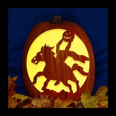 a carved pumpkin with a horse and rider on it