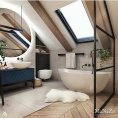 an image of a bathroom setting with skylights above the bathtub and toilet area