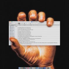 a hand holding up a computer screen with the keyboard highlighted