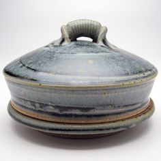 this is a ceramic dish with a lid