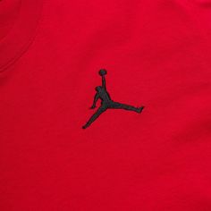 a red shirt with a black jordan logo on it