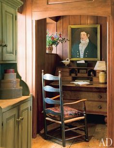 an old fashioned desk and chair in a room