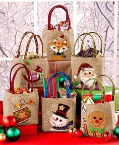 several bags are stacked on top of each other in front of christmas decorations and ornaments