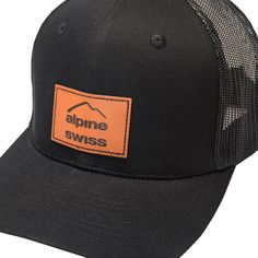 the alpine swiss hat is black with an orange patch on the front and back side