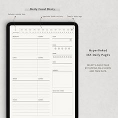 a black and white daily planner on top of a clipboard with the words daily food diary