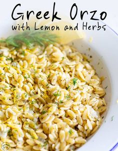 a white bowl filled with lemon and herbs