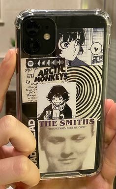 someone is holding up their phone case with some pictures on it