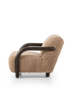 a chair that is made out of sheep wool and has a black frame on it