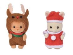 two small stuffed animals wearing christmas clothes and hats, one in the shape of a deer