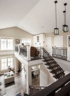 a living room filled with furniture and a staircase