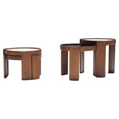 three wooden tables sitting next to each other