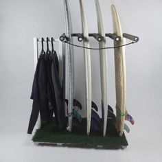 several surfboards are hanging on a rack