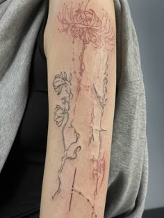 a woman with a tattoo on her arm