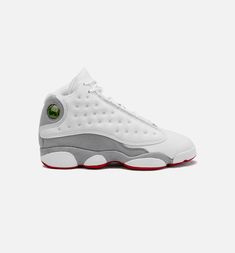 Dressed in a White, True Red, and Wolf Grey color scheme. This offering of the Air Jordan 13 features a Whit tumbled leather upper with Wolf Grey suede overlays on the mudguards, midsole, and heels. Other details includes a Red Jumpman logo embroidered on the tongues matching its runner outsole. The model’s signature hologram, which switches out the Michael Jordan figure in the Jumpman pose in front of a 23, on the ankle collar atop a White midsole completes the design. Gray And White Jordans, Aj1 Mid, School Lifestyle, White Jordans, Air Jordan 13 Retro, Jumpman Logo, Grey Color Scheme, Jordan 13 Retro, Jordan 13