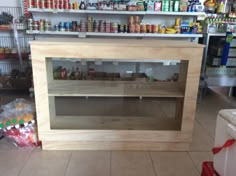 an empty wooden cabinet in a store