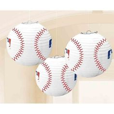 three baseball paper lanterns hanging from the ceiling