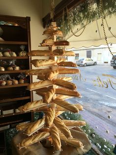 a display in a bakery filled with lots of bread