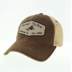 Our trucker hat has an unstructured crown with the Murray's Fly Shop name on the front. The visor is fully curved and one size fits all with the open back snap closure. Made of cotton twill with soft mesh back. Colors: Olive with tan mesh & kelly green under the visor or Brown with tan mesh & kelly green under the visor Olive Tan, Shop Name, Fly Shop, Kelly Green, Cotton Twill, One Size Fits All, Snap Closure, Open Back, Trucker Hat