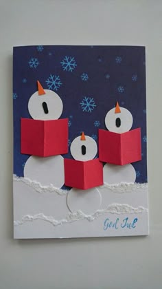 an origami card with two snowmen on it