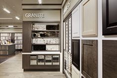 the interior of a granite store with white and brown walls